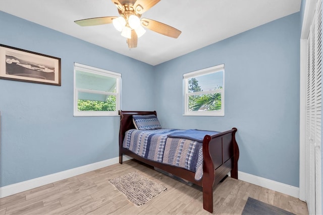4718 24th Ave S, Saint Petersburg, FL 33711 - bedroom with multiple windows, light wood-type flooring, and a ceiling fan