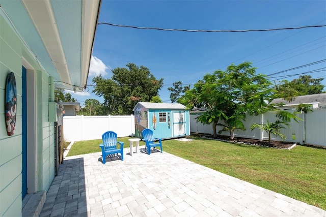 4718 24th Ave S, Saint Petersburg, FL 33711 - fenced backyard with a patio area and a shed
