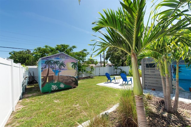 4718 24th Ave S, Saint Petersburg, FL 33711 - fenced backyard with a storage unit and a patio