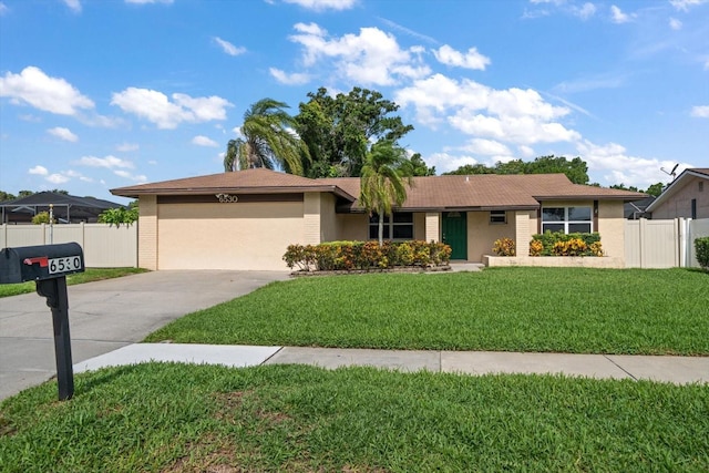 6530 68th St N, Pinellas Park, FL 33781 - ranch-style home featuring driveway, an attached garage, and stucco siding