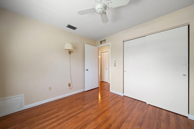6530 68th St N, Pinellas Park, FL 33781 - unfurnished bedroom featuring wood finished floors, a closet, and ceiling fan