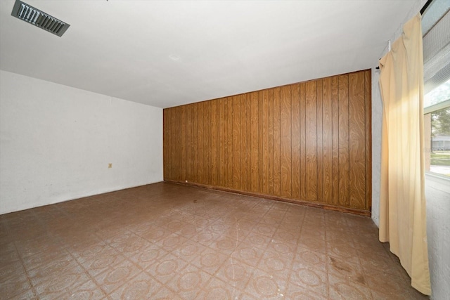 6530 68th St N, Pinellas Park, FL 33781 - additional living space with wooden walls and tile patterned floors