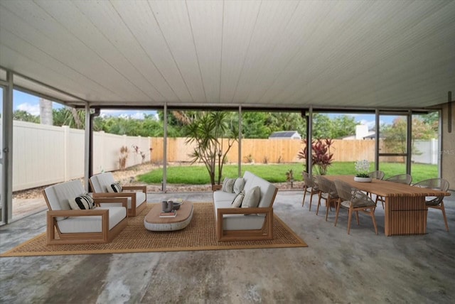 6530 68th St N, Pinellas Park, FL 33781 - sunroom / solarium with outdoor dining space and an outdoor living space