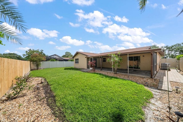 6530 68th St N, Pinellas Park, FL 33781 - rear view of house with stucco siding, a fenced backyard, and a patio