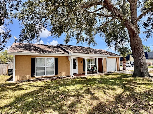 3902 Glissade Dr, New Port Richey, FL 34652 - ranch-style house featuring an attached garage, covered porch, and stucco siding