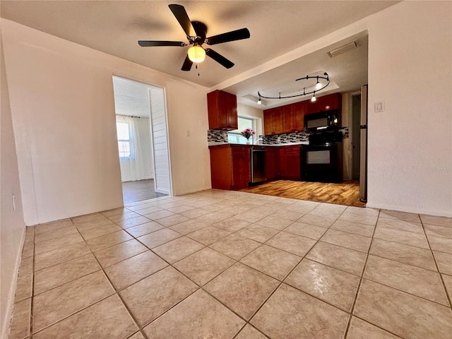 3902 Glissade Dr, New Port Richey, FL 34652 - kitchen featuring black appliances, light tile patterned floors, tasteful backsplash, ceiling fan, and open floor plan
