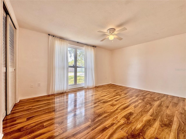 3902 Glissade Dr, New Port Richey, FL 34652 - unfurnished room with wood finished floors and ceiling fan