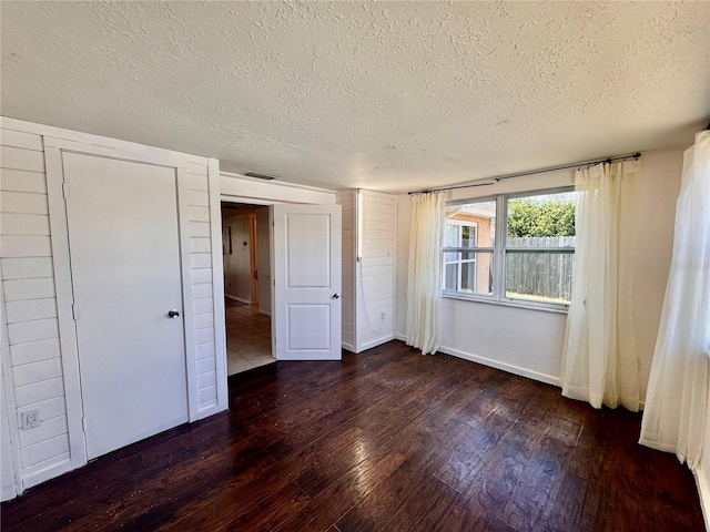 3902 Glissade Dr, New Port Richey, FL 34652 - unfurnished bedroom featuring a textured ceiling and hardwood / wood-style floors