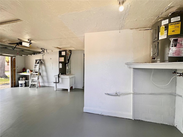 3902 Glissade Dr, New Port Richey, FL 34652 - garage featuring heating unit and baseboards