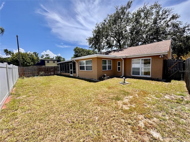 3902 Glissade Dr, New Port Richey, FL 34652 - back of house featuring a fenced backyard and stucco siding