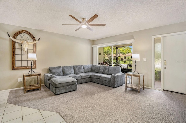2270 Spruce Ln Unit B, Palm Harbor, FL 34684 - tiled living area featuring carpet floors, a ceiling fan, and a textured ceiling