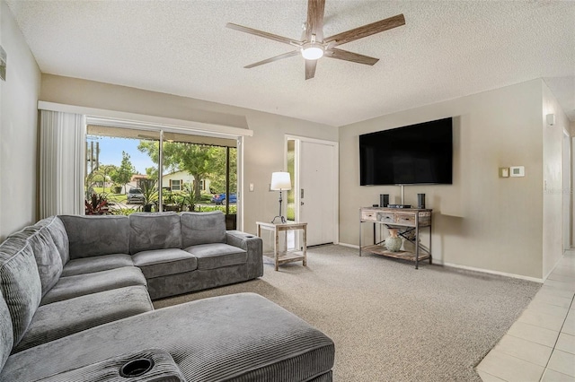 2270 Spruce Ln Unit B, Palm Harbor, FL 34684 - tiled living room with ceiling fan and a textured ceiling