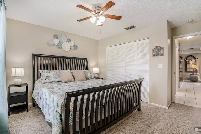 2270 Spruce Ln Unit B, Palm Harbor, FL 34684 - bedroom with carpet, a closet, ceiling fan, and a textured ceiling