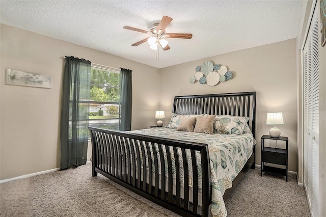 2270 Spruce Ln Unit B, Palm Harbor, FL 34684 - bedroom featuring carpet floors, a textured ceiling, a ceiling fan, and a closet