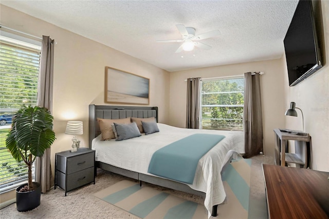 2270 Spruce Ln Unit B, Palm Harbor, FL 34684 - carpeted bedroom with a textured ceiling and ceiling fan