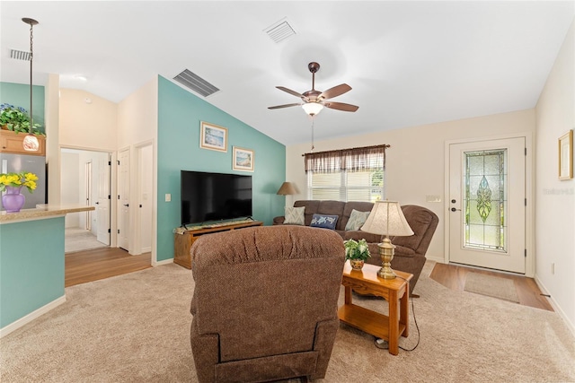 1032 Kelsea Cir, The Villages, FL 32159 - living room featuring light carpet, lofted ceiling, and ceiling fan