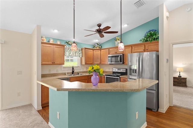 1032 Kelsea Cir, The Villages, FL 32159 - kitchen featuring appliances with stainless steel finishes, ceiling fan, vaulted ceiling, light countertops, and pendant lighting