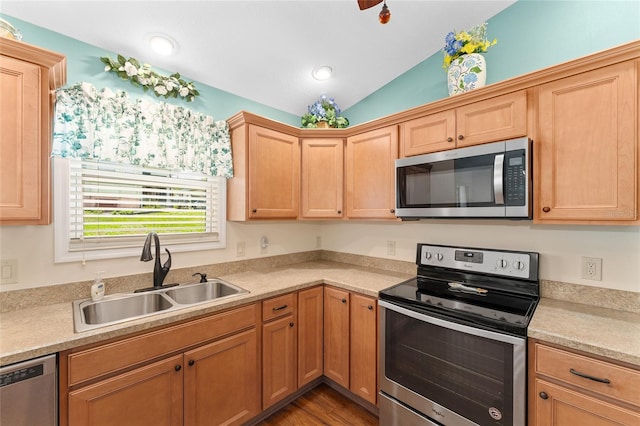 1032 Kelsea Cir, The Villages, FL 32159 - kitchen featuring appliances with stainless steel finishes, vaulted ceiling, light countertops, dark wood-style flooring, and recessed lighting