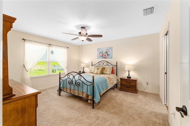 1032 Kelsea Cir, The Villages, FL 32159 - bedroom featuring light carpet and ceiling fan