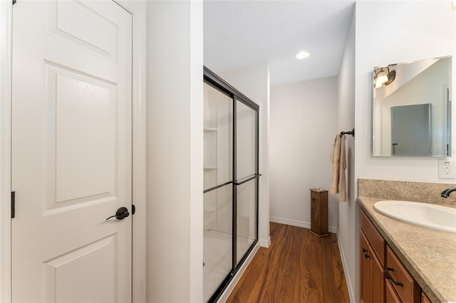 1032 Kelsea Cir, The Villages, FL 32159 - full bath featuring a stall shower, vanity, wood finished floors, and recessed lighting