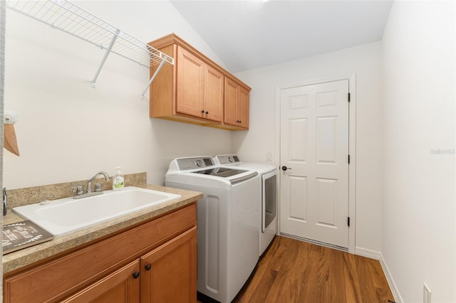 1032 Kelsea Cir, The Villages, FL 32159 - laundry room with washer and dryer, cabinet space, and wood finished floors
