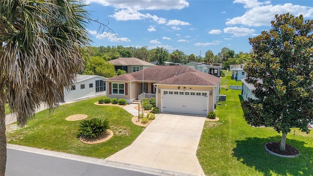 1032 Kelsea Cir, The Villages, FL 32159 - single story home with concrete driveway, a garage, and a shingled roof