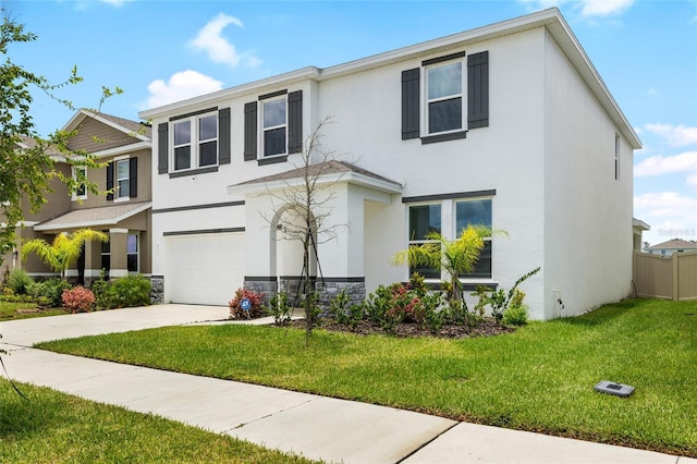 33675 Elm Hill Br, Wesley Chapel, FL 33545 - view of front facade with stucco siding, an attached garage, driveway, and stone siding