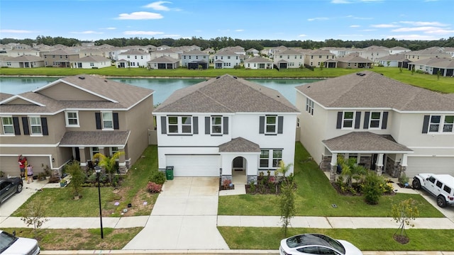 33675 Elm Hill Br, Wesley Chapel, FL 33545 - townhome / multi-family property with a residential view, a garage, and stucco siding
