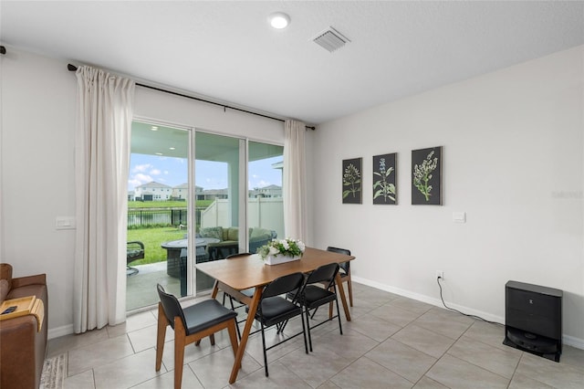 33675 Elm Hill Br, Wesley Chapel, FL 33545 - dining space featuring light tile patterned flooring and a water view
