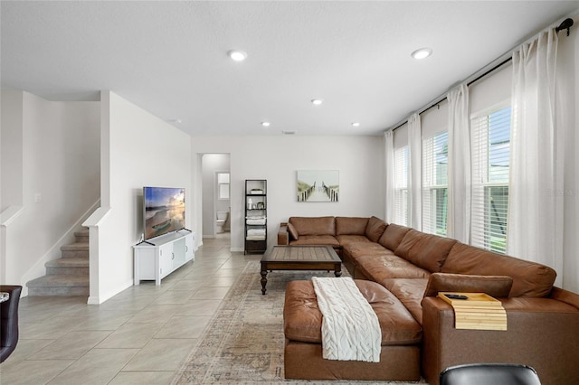 33675 Elm Hill Br, Wesley Chapel, FL 33545 - living room with light tile patterned floors, stairway, and recessed lighting