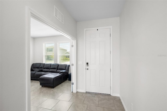 33675 Elm Hill Br, Wesley Chapel, FL 33545 - foyer featuring light tile patterned flooring and baseboards