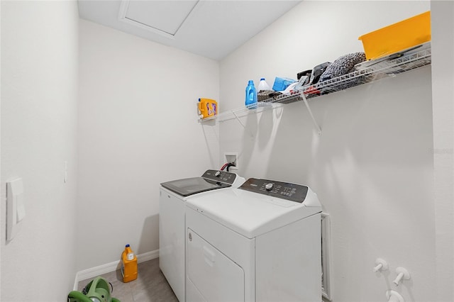 33675 Elm Hill Br, Wesley Chapel, FL 33545 - washroom featuring washer and dryer and baseboards
