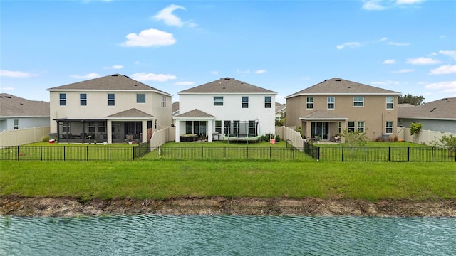 33675 Elm Hill Br, Wesley Chapel, FL 33545 - rear view of property with a sunroom, a water view, a fenced backyard, and stucco siding