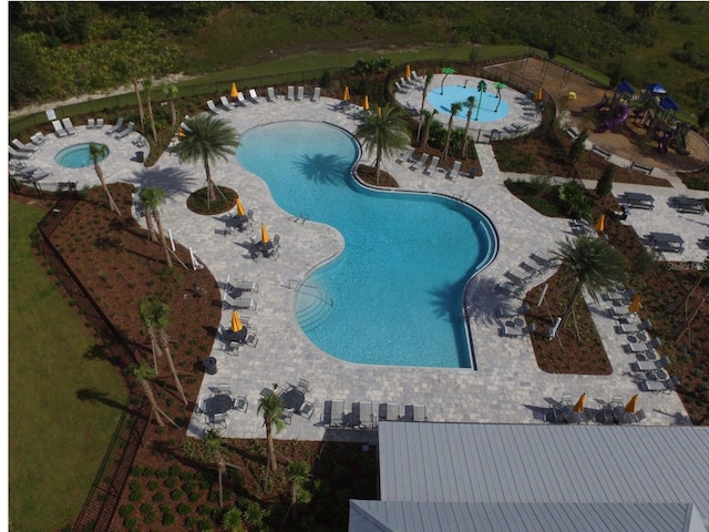 33675 Elm Hill Br, Wesley Chapel, FL 33545 - community pool featuring a patio area