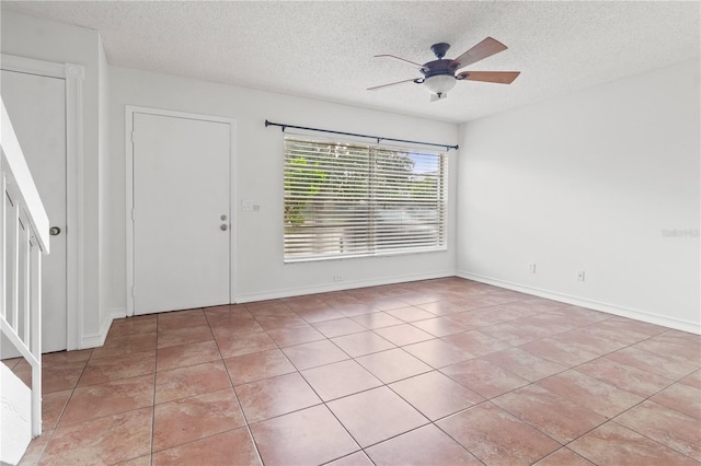 15636 Morning Dr, Lutz, FL 33559 - unfurnished room featuring a textured ceiling, a ceiling fan, and light tile patterned floors