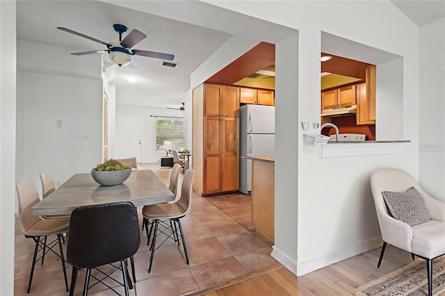 15636 Morning Dr, Lutz, FL 33559 - dining space featuring a ceiling fan and light wood finished floors