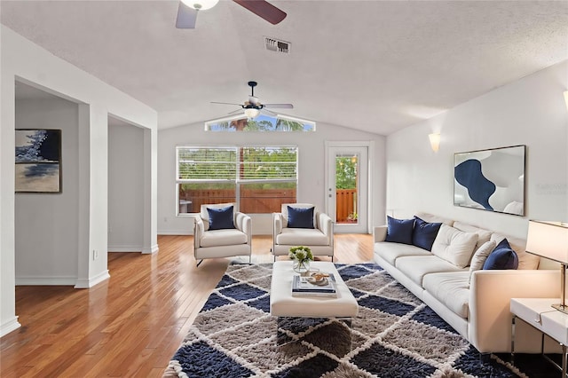15636 Morning Dr, Lutz, FL 33559 - living area with ceiling fan, vaulted ceiling, and light wood-style floors