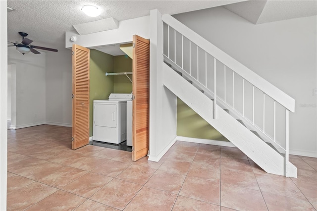 15636 Morning Dr, Lutz, FL 33559 - laundry room featuring washing machine and clothes dryer, light tile patterned floors, a textured ceiling, and ceiling fan