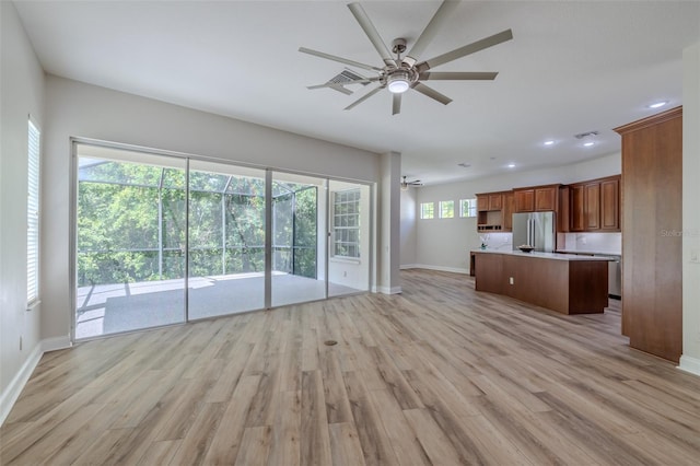 5224 Fairway One Dr, Valrico, FL 33596 - unfurnished living room featuring ceiling fan, light wood-style flooring, and recessed lighting