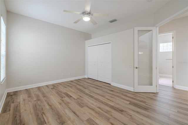 5224 Fairway One Dr, Valrico, FL 33596 - unfurnished bedroom with light wood-style flooring, a closet, and ceiling fan