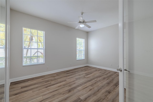 5224 Fairway One Dr, Valrico, FL 33596 - unfurnished room with wood finished floors and ceiling fan