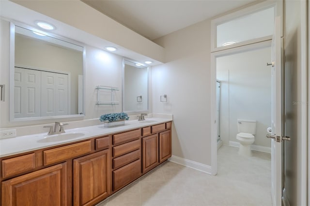 5224 Fairway One Dr, Valrico, FL 33596 - bathroom featuring double vanity, a shower stall, tile patterned floors, and recessed lighting