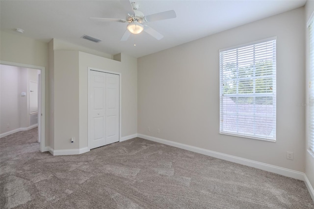 5224 Fairway One Dr, Valrico, FL 33596 - unfurnished bedroom with carpet, a closet, and ceiling fan