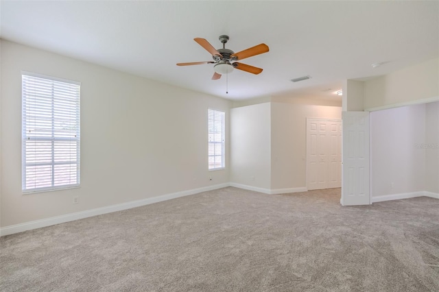 5224 Fairway One Dr, Valrico, FL 33596 - empty room featuring light carpet and a ceiling fan