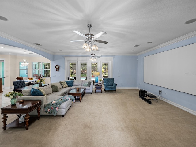 7427 20th St, Zephyrhills, FL 33540 - living room featuring ceiling fan, carpet floors, crown molding, and a chandelier