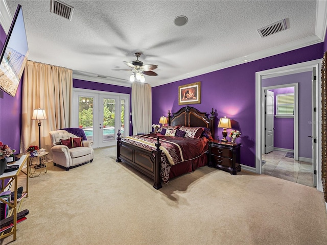 7427 20th St, Zephyrhills, FL 33540 - carpeted bedroom with french doors, access to exterior, crown molding, a textured ceiling, and ceiling fan