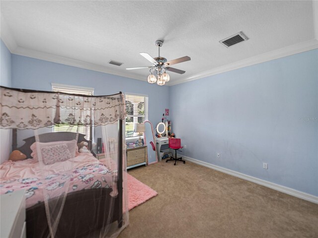 7427 20th St, Zephyrhills, FL 33540 - carpeted bedroom featuring crown molding, a ceiling fan, and a textured ceiling