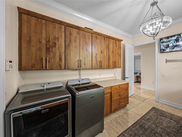 7427 20th St, Zephyrhills, FL 33540 - laundry room featuring cabinet space, separate washer and dryer, a chandelier, light tile patterned flooring, and ornamental molding