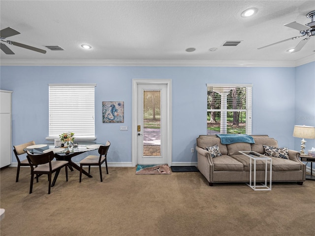 7427 20th St, Zephyrhills, FL 33540 - carpeted living room with ceiling fan, ornamental molding, recessed lighting, and a textured ceiling