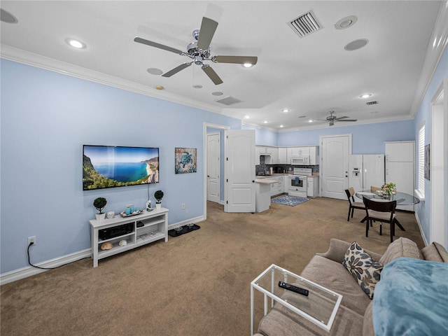 7427 20th St, Zephyrhills, FL 33540 - living area featuring a ceiling fan, ornamental molding, light carpet, and recessed lighting